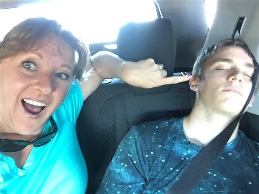 CarrieAnne laughing on a road trip
